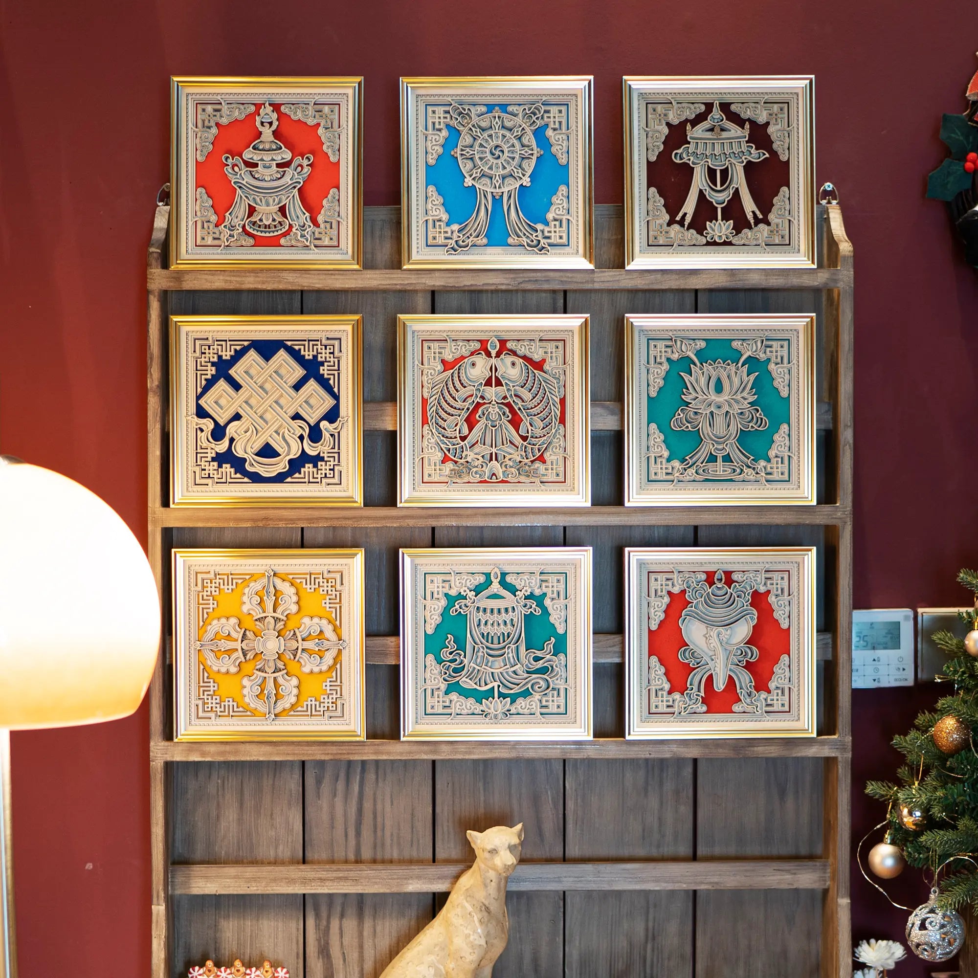 Collection of multi-color framed laser-cut wood art pieces displayed on shelves