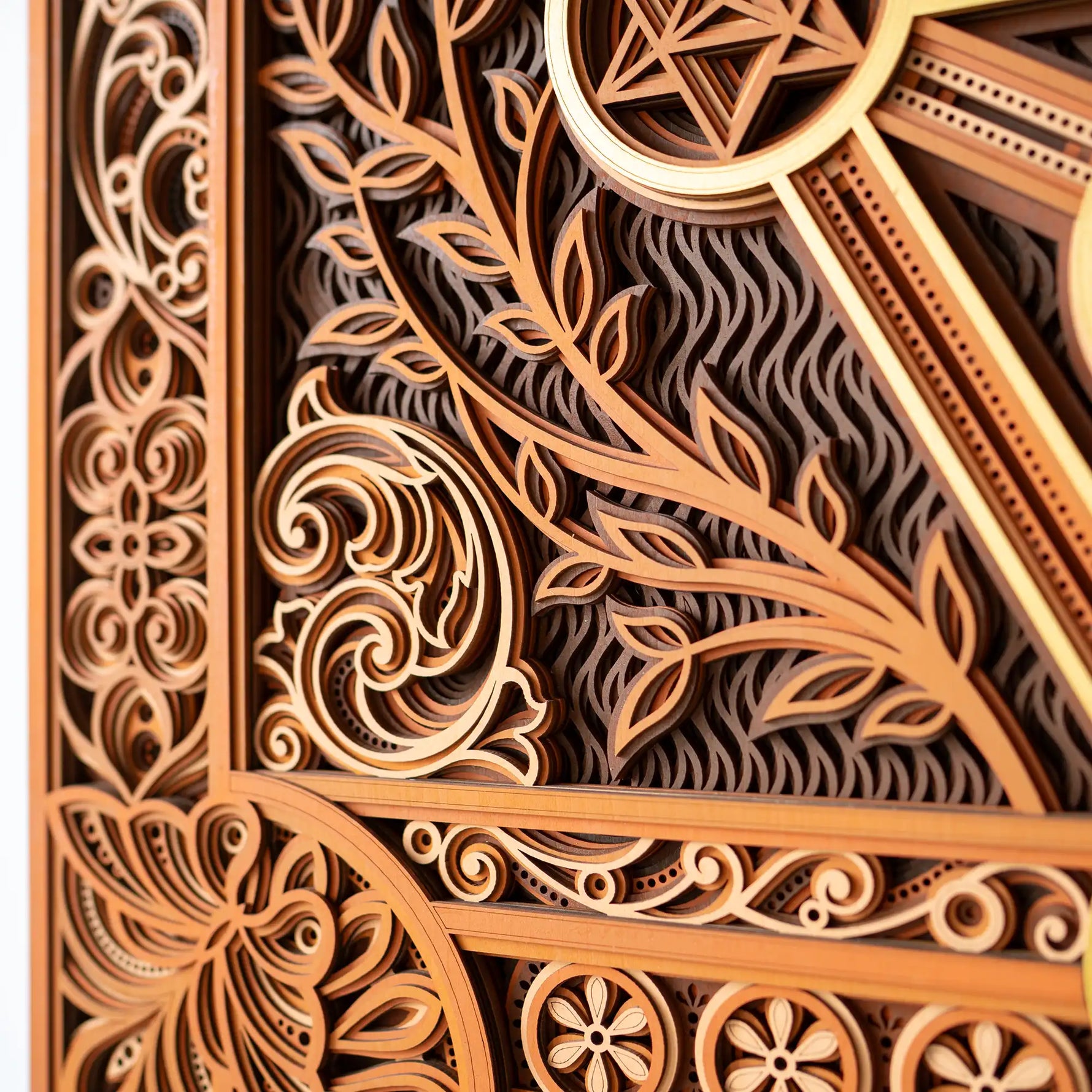 Close-up of intricate wooden carvings with floral and geometric patterns.