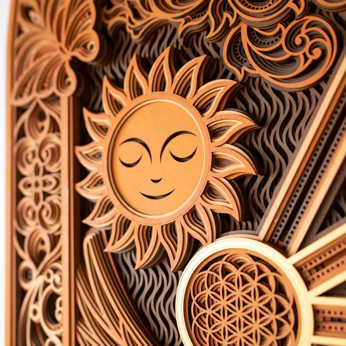 Decorative wooden panel with sun design and intricate patterns