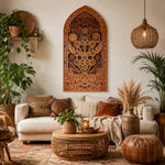 Cozy living room with decorative wall art, plants, and a textured rug.